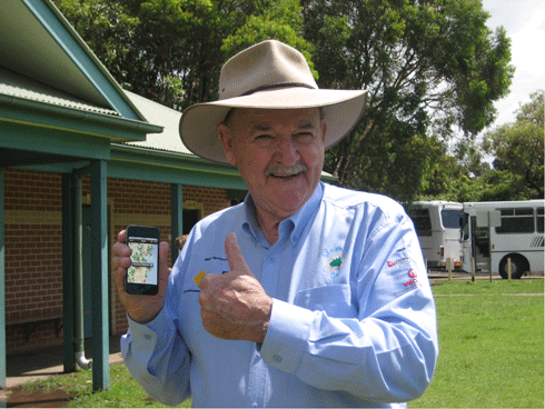 Ian Kiernan, founder of Clean Up Australia, holds an iPhone displaying the new ‘iClean Up’ app.