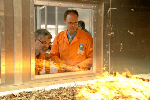 A CSIRO team led by Dr Andrew Sullivan (right) utilises a ‘pyrotron’ – a 25 metre long, fire-proof wind tunnel – to measure combustion and spread of bushfires. The facility enables close observation of fuel-combustion mechanisms not possible in the field.