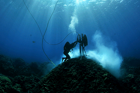 A researcher from AIMS (WA) coring corals in the Indian Ocean.