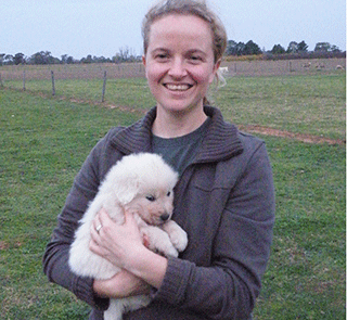 Linda van Bommel with a Maremma pup.