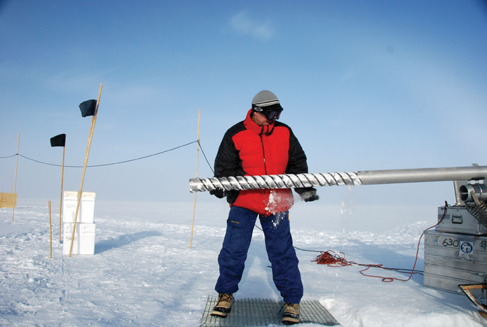 David Etheridge extracts a core from the ice drill used to access large samples of air from below ground in Greenland.